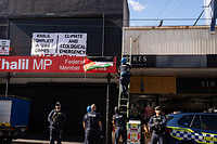 Activists climb Labour Mp office Peter Khalil in Melbourne